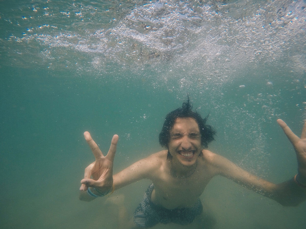 How to travel solo - be flexible - me swimming in Langkawi